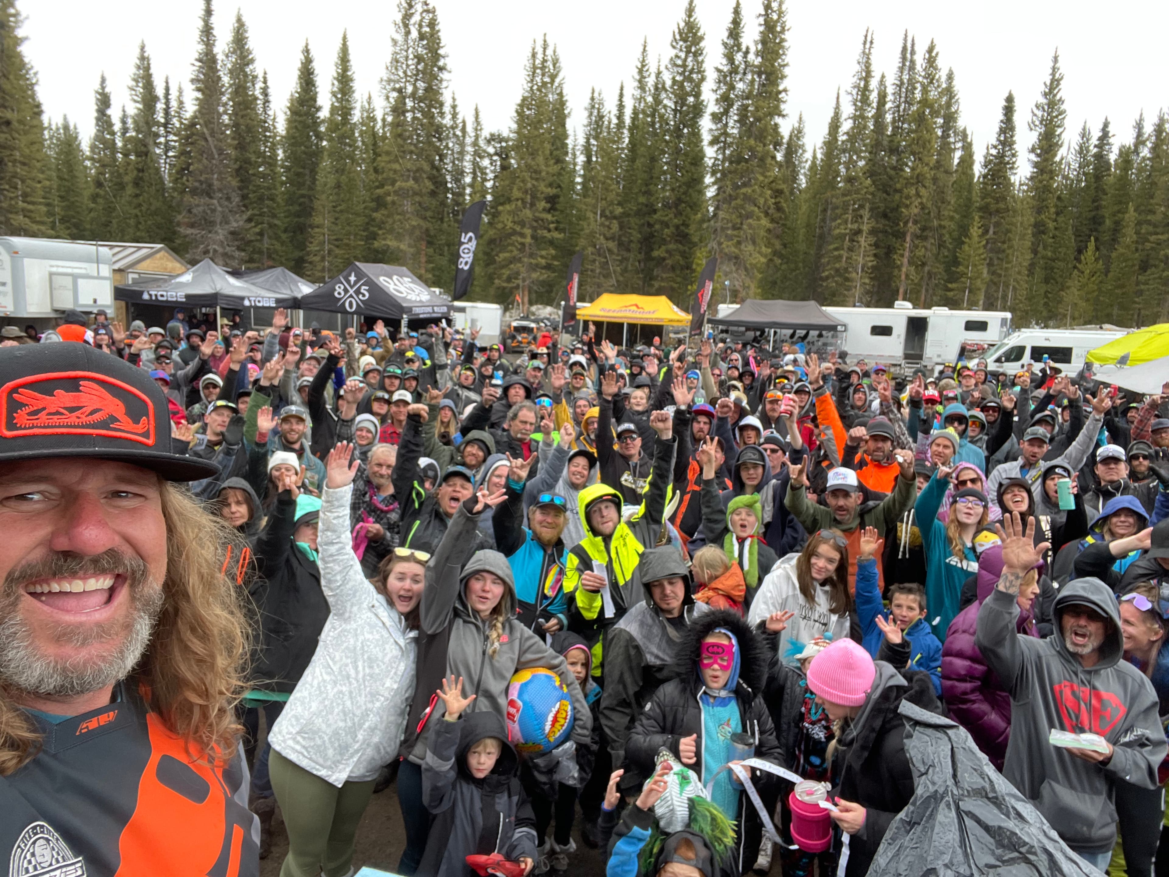 Brandon Cox with a snowmobile community crowd at Spring Fling
